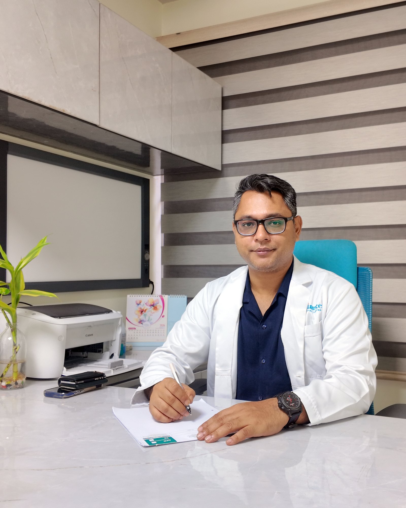 Dr. Md. Nagib Mahfuz Khan consulting a patient